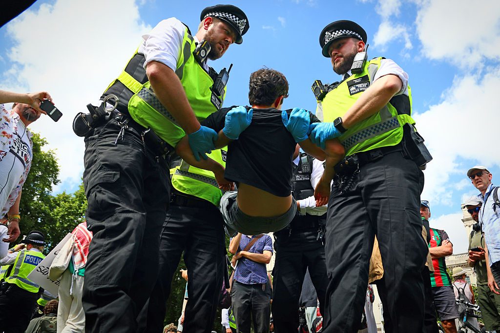 By six o’clock, at least 365 protesters had been arrested. Credit: Getty