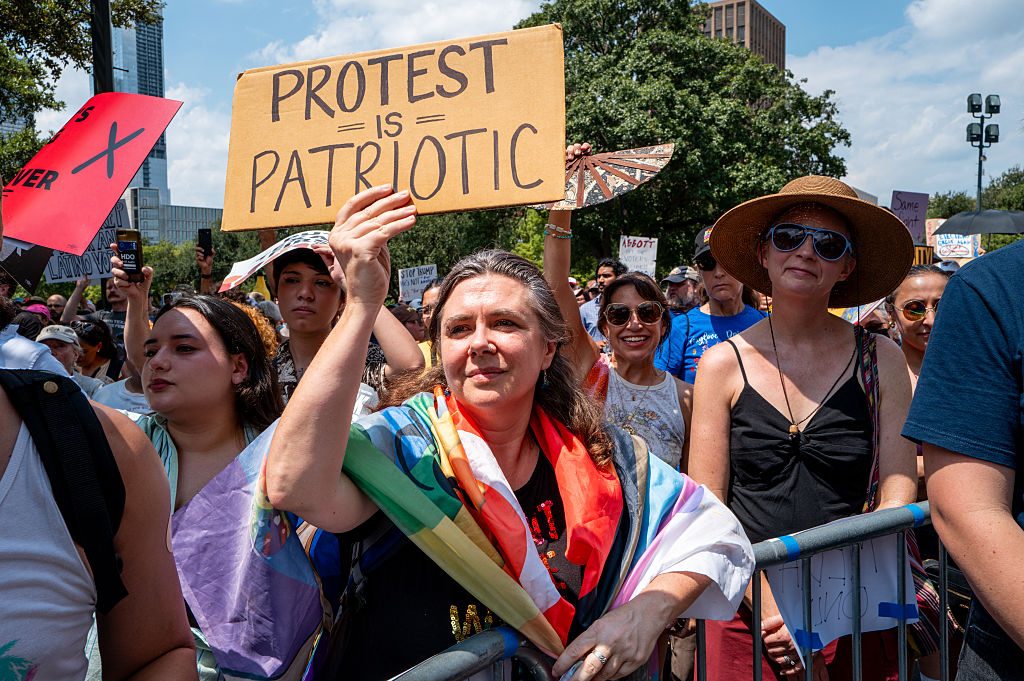 Homemade signs were out in force in Austin. Credit: Getty