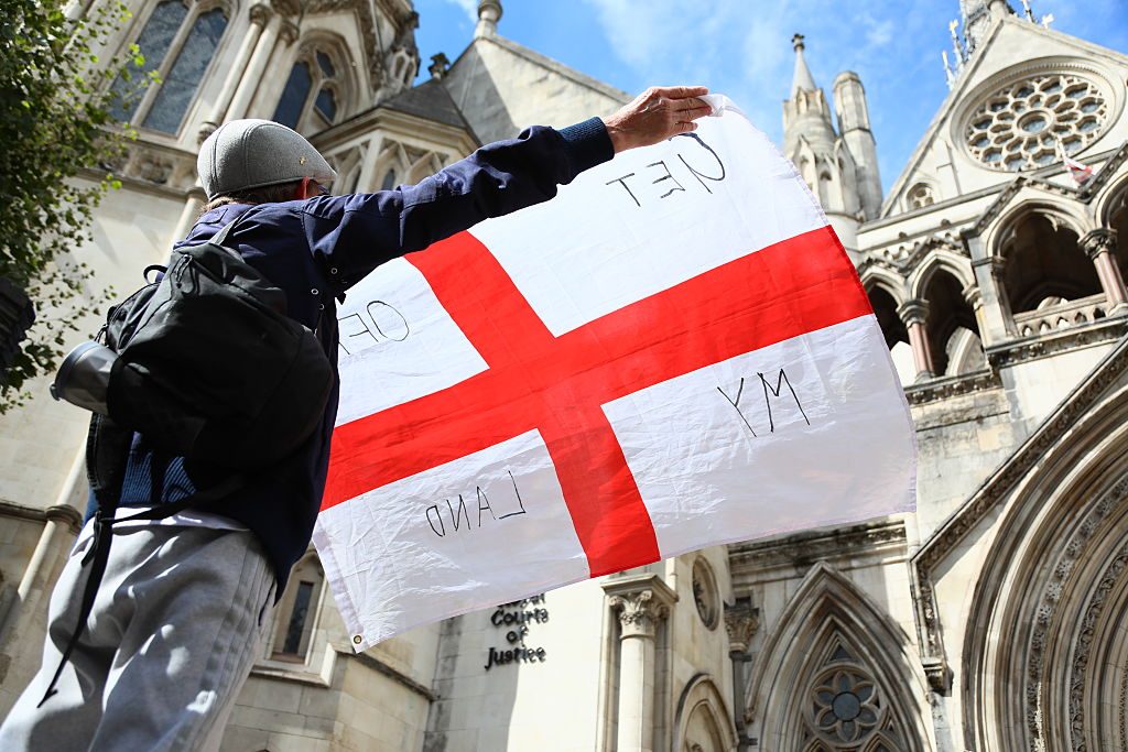 A protester outside the Court of Appeal ahead of today's ruling. Credit: Getty