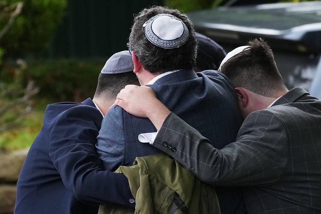 Mourning worshippers near the Heaton Park Hebrew Congregation Synagogue, where the attack took place. Credit: Getty