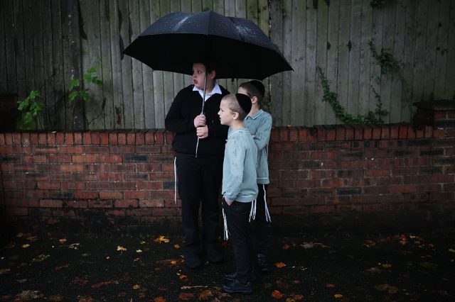 Young Jews await a vigil. Christopher Furlong/Getty Images
