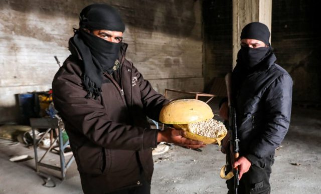 Syria's anti-drug officers behave more like militiamen than drug-busting law enforcers, their Kalashnikovs hanging by their sides. (Bakr Alkasem/AFP/Getty)