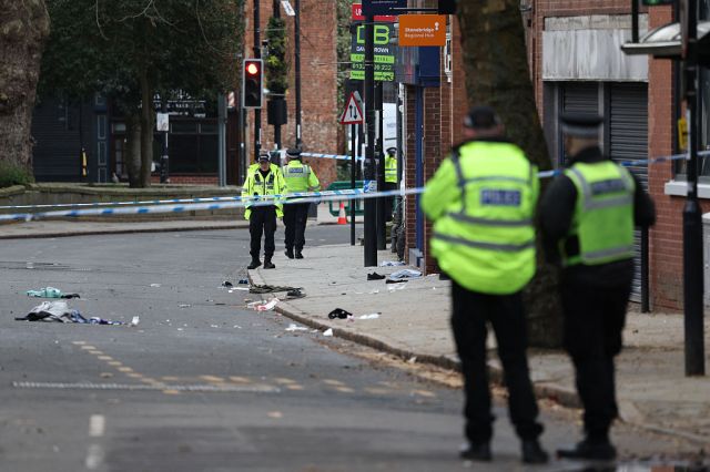 Police officers attend the scene of the incident in Derby on Sunday. Credit: Getty