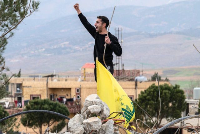 A Lebanese man shouts in support of Hezbollah at the scene of an Israeli air strike in Bekaa Valley, on March 23, 2026. (Guy Smallman / Getty)