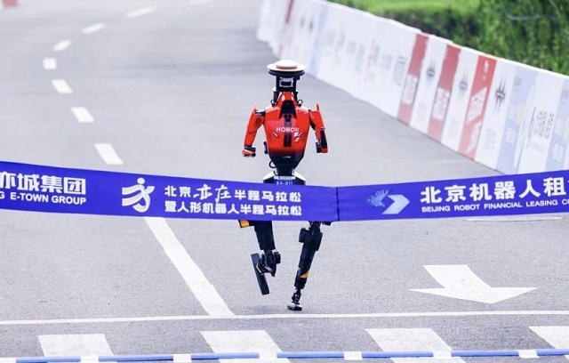 A robot won a race in Beijing on April 19th. Some humans, but not others, will win with them. Credit: Getty