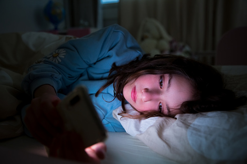There are good reasons to think that the harms associated with smartphones operate less through social media itself than through the activities it displaces — like sleep. (Suzi Media Production/Getty)