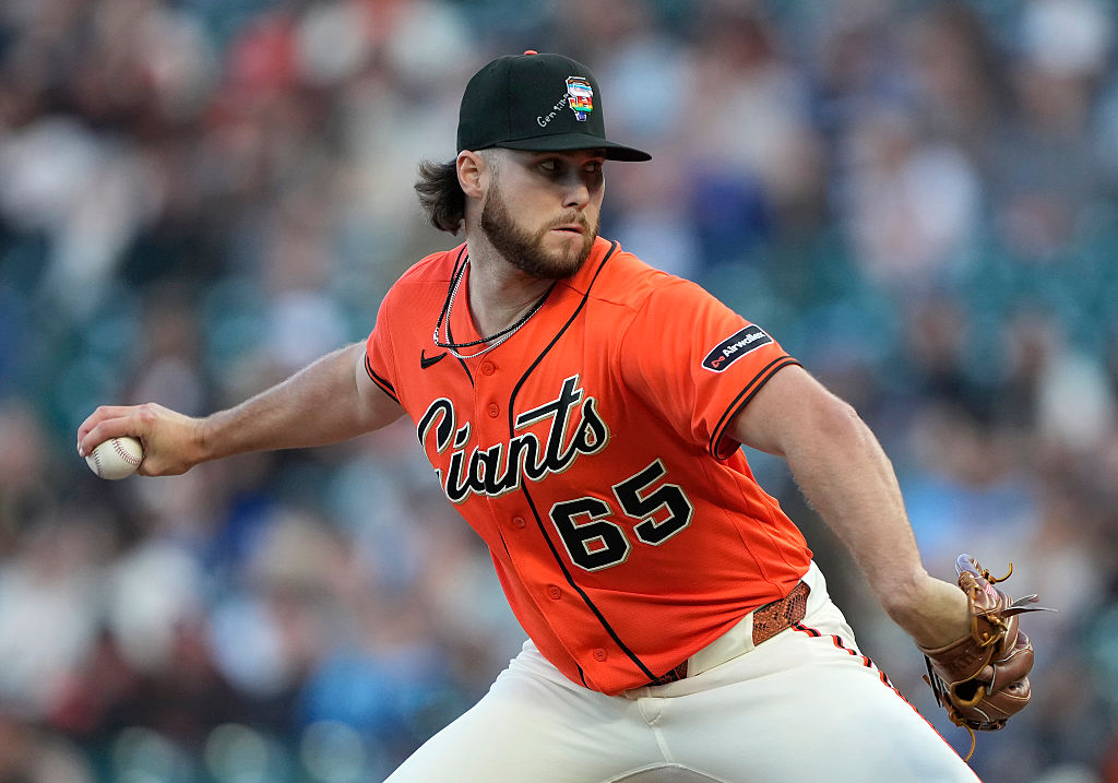 San Francisco Giants pitcher Landen Roupp playing against the Chicago Cubs with a Bible verse on his cap. Credit: Getty