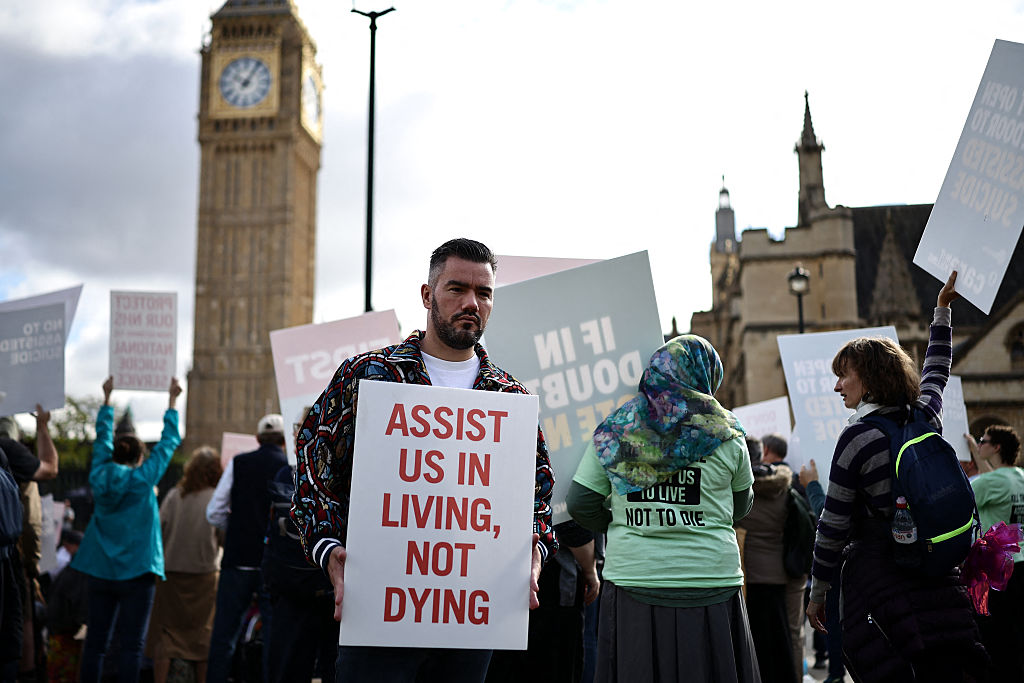 A campaigner against a change in the law on assisted dying outside Parliament today. Credit: Getty